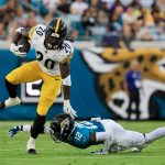 Pittsburgh Steelers running back Kaleb Johnson (20) outpaces Jacksonville Jaguars wide receiver Travis Hunter (12) who can’t make the tackle during the second quarter of an NFL preseason matchup at EverBank Stadium, Saturday, Aug. 9, 2025 in Jacksonville, Fla. [Corey Perrine/Florida Times-Union]