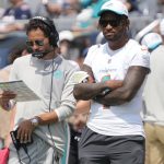 Aug 10, 2025; Chicago, Illinois, USA;Miami Dolphins head coach Mike McDaniels with quarterback Tua Tagovailoa (1) on thee sidelines during the second half of a game against the Chicago Bears at Soldier Field. Mandatory Credit: David Banks-Imagn Images