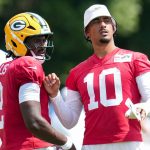 Green Bay Packers quarterback Jordan Love (10) speaks with quarterback Malik Willis (2) on Thursday, Aug. 14, 2025, at a joint practice with the Indianapolis Colts during the Colts’ training camp at Grand Park in Westfield.