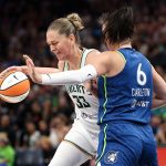 Aug 16, 2025; Minneapolis, Minnesota, USA; New York Liberty center Emma Meesseman (33) drives towards the basket as Minnesota Lynx forward Bridget Carleton (6) defends during the first quarter at Target Center. Mandatory Credit: Matt Krohn-Imagn Images
