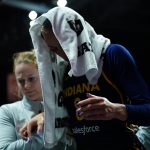 Aug 17, 2025; Uncasville, Connecticut, USA; Indiana Fever guard Sophie Cunningham (8) is helped off the court injured as they take on the Connecticut Sun in the first half at Mohegan Sun Arena. Mandatory Credit: David Butler II-Imagn Images