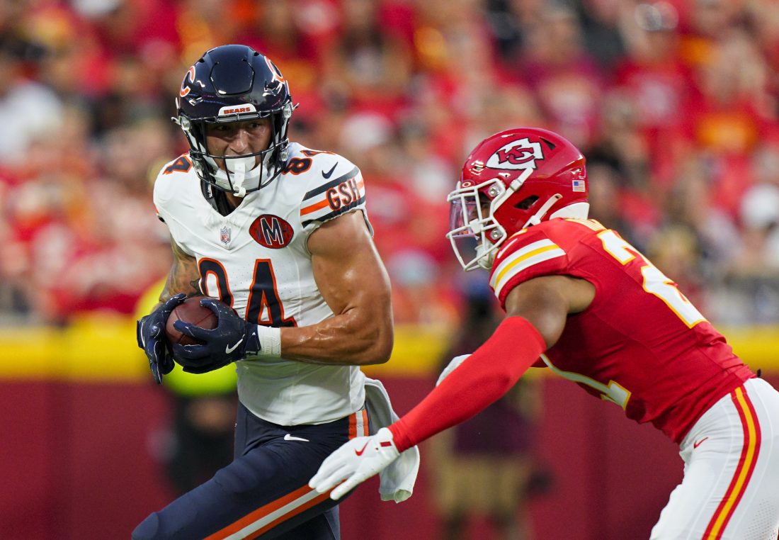 Aug 22, 2025; Kansas City, Missouri, USA; Chicago Bears tight end Colston Loveland (84) runs with the ball against Kansas City Chiefs safety Jaden Hicks (21) during the first half at GEHA Field at Arrowhead Stadium. Mandatory Credit: Jay Biggerstaff-Imagn Images
