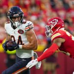 Aug 22, 2025; Kansas City, Missouri, USA; Chicago Bears tight end Colston Loveland (84) runs with the ball against Kansas City Chiefs safety Jaden Hicks (21) during the first half at GEHA Field at Arrowhead Stadium. Mandatory Credit: Jay Biggerstaff-Imagn Images