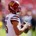 Aug 23, 2025; Landover, Maryland, USA; Washington Commanders quarterback Sam Hartman (15) warms up before playing against the Baltimore Ravens at Northwest Stadium. Mandatory Credit: Peter Casey-Imagn Images