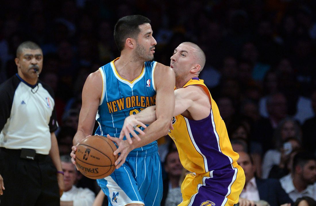 Apr 9, 2013; Los Angeles, CA, USA; Los Angeles Lakers point guard Steve Blake (5) guards New Orleans Hornets point guard Greivis Vasquez (21) in the first half at the Staples Center. Mandatory Credit: Jayne Kamin-Oncea-USA TODAY Sports