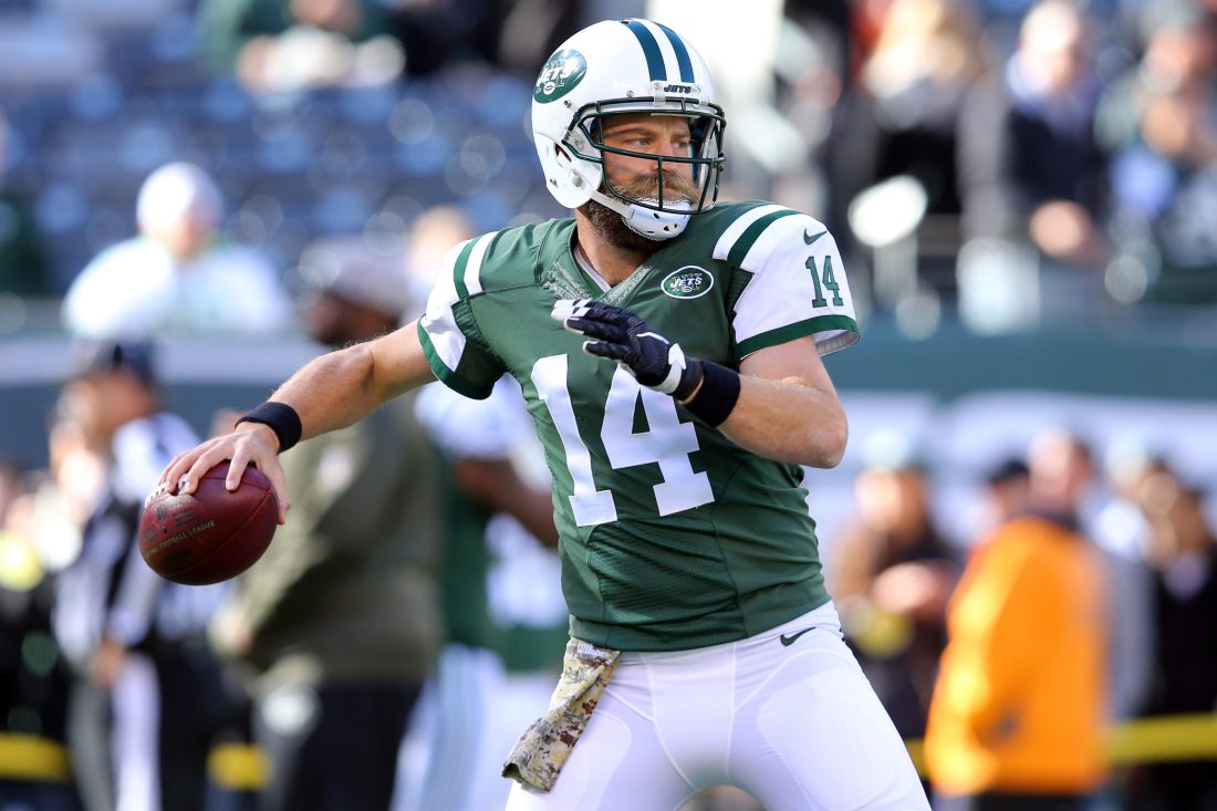 Nov 8, 2015; East Rutherford, NJ, USA; New York Jets quarterback Ryan Fitzpatrick (14) drops back to pass during warmups before a game against the Jacksonville Jaguars at MetLife Stadium. Fitzpatrick is wearing a protective glove on his injured left hand. Mandatory Credit: Brad Penner-USA TODAY Sports