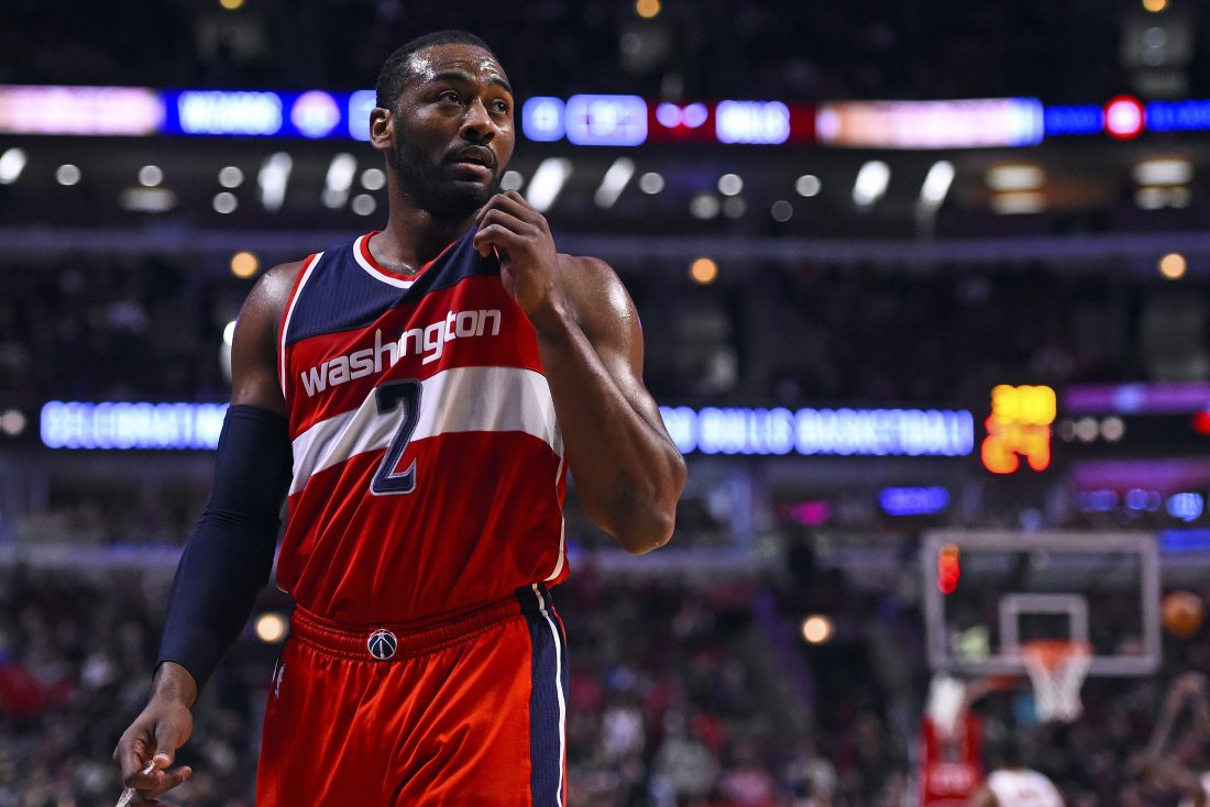 Jan 11, 2016; Chicago, IL, USA; Washington Wizards guard John Wall (2) reacts after a play against the Chicago Bulls during the second half at the United Center. The Wizards defeat the Bulls 114-100. Mandatory Credit: Mike DiNovo-USA TODAY Sports