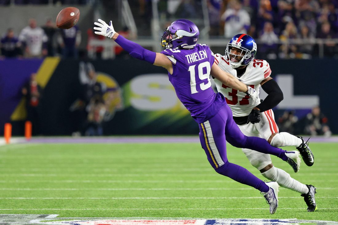 Jan 15, 2023; Minneapolis, Minnesota, USA; Minnesota Vikings wide receiver Adam Thielen (19) is unable to catch a pass while defended by New York Giants cornerback Fabian Moreau (37) during the fourth quarter during a wild card game at U.S. Bank Stadium. Mandatory Credit: Matt Krohn-USA TODAY Sports