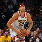 Apr 25, 2023; Denver, Colorado, USA; Denver Nuggets forward Aaron Gordon (50) prepares to launch a full court shot in the first quarter against the Minnesota Timberwolves in game five of the 2023 NBA Playoffs at Ball Arena. Mandatory Credit: Ron Chenoy-USA TODAY Sports