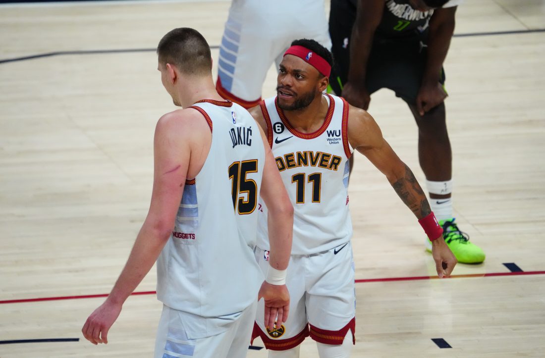 Apr 25, 2023; Denver, Colorado, USA; Denver Nuggets center Nikola Jokic (15) celebrates his basket and foul with forward Bruce Brown (11) in the fourth quarter against the Minnesota Timberwolves during game five of the 2023 NBA Playoffs at Ball Arena. Mandatory Credit: Ron Chenoy-USA TODAY Sports
