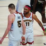 Apr 25, 2023; Denver, Colorado, USA; Denver Nuggets center Nikola Jokic (15) celebrates his basket and foul with forward Bruce Brown (11) in the fourth quarter against the Minnesota Timberwolves during game five of the 2023 NBA Playoffs at Ball Arena. Mandatory Credit: Ron Chenoy-USA TODAY Sports