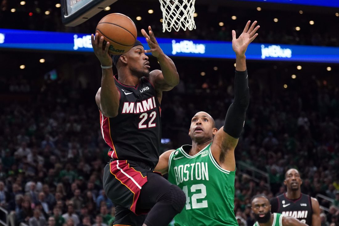 May 29, 2023; Boston, Massachusetts, USA; Miami Heat forward Jimmy Butler (22) grabs a rebound against Boston Celtics center Al Horford (42) in the first quarter during game seven of the Eastern Conference Finals for the 2023 NBA playoffs at TD Garden. Mandatory Credit: David Butler II-USA TODAY Sports