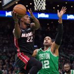 May 29, 2023; Boston, Massachusetts, USA; Miami Heat forward Jimmy Butler (22) grabs a rebound against Boston Celtics center Al Horford (42) in the first quarter during game seven of the Eastern Conference Finals for the 2023 NBA playoffs at TD Garden. Mandatory Credit: David Butler II-USA TODAY Sports