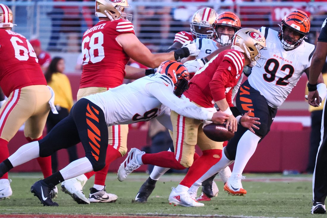 Oct 29, 2023; Santa Clara, California, USA; Cincinnati Bengals defensive end Trey Hendrickson (91) forces a fumble by San Francisco 49ers quarterback Brock Purdy (13) during the fourth quarter at Levi's Stadium. Mandatory Credit: Kelley L Cox-USA TODAY Sports