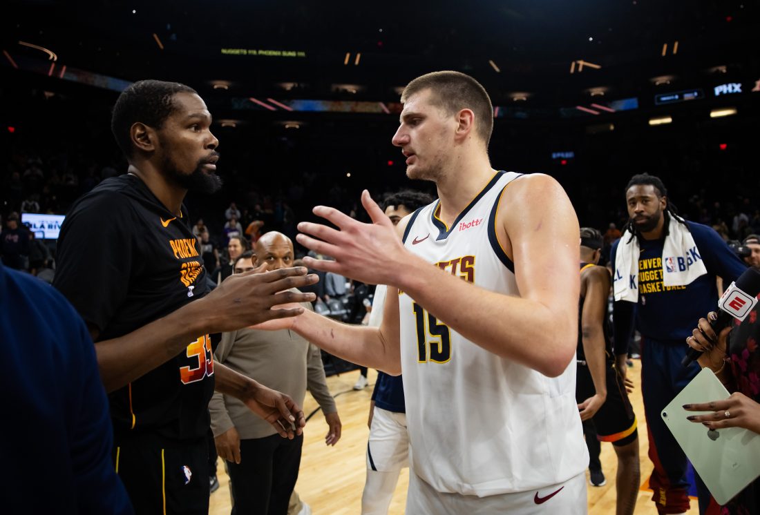 Dec 1, 2023; Phoenix, Arizona, USA; Denver Nuggets center Nikola Jokic (right) greets Phoenix Suns forward Kevin Durant following the game at Footprint Center. Mandatory Credit: Mark J. Rebilas-USA TODAY Sports