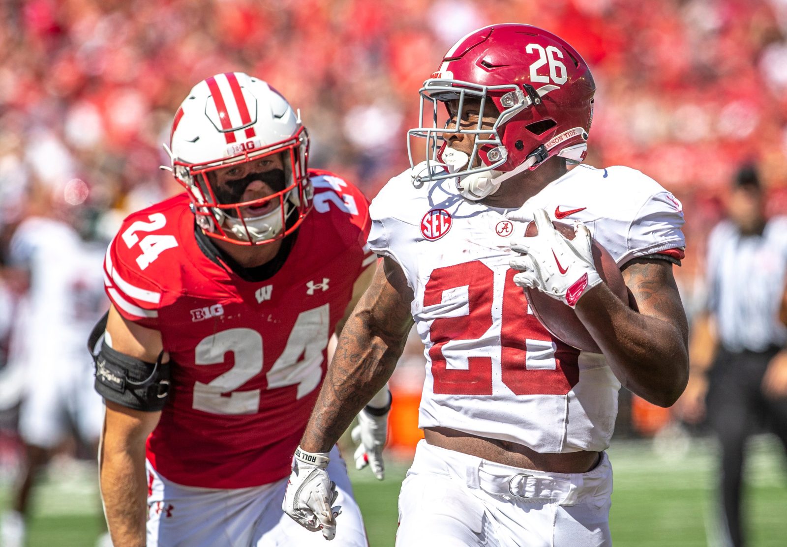 Alabama running back Jam Miller (26) runs a touchdown from Wisconsin Hunter Wohler during the game at Camp Randall Stadium in Madison, Wis. on Saturday, September 14, 2024.