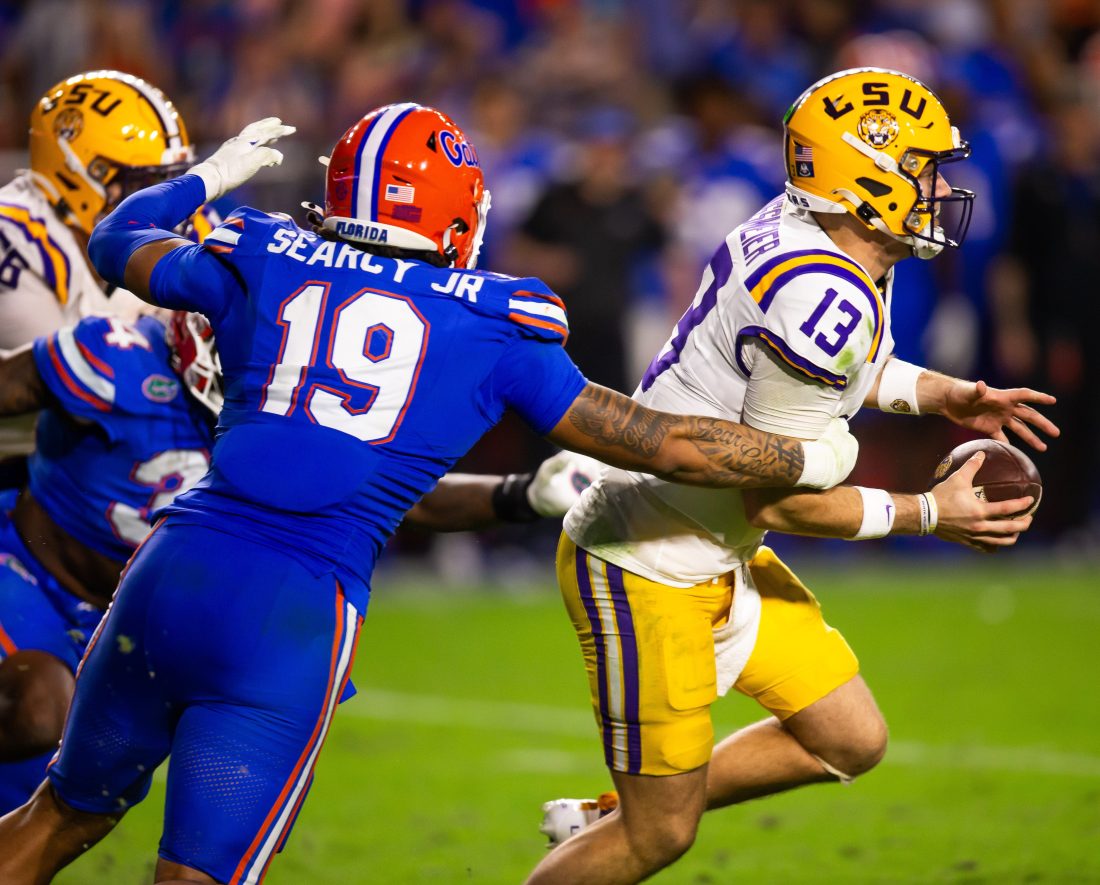 Florida Gators edge T.J. Searcy (19) sacks LSU Tigers quarterback Garrett Nussmeier (13) during the second half at Ben Hill Griffin Stadium in Gainesville, FL on Saturday, November 16, 2024. The Gators defeated the Tigers 27-16. [Doug Engle/Gainesville Sun]