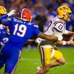 Florida Gators edge T.J. Searcy (19) sacks LSU Tigers quarterback Garrett Nussmeier (13) during the second half at Ben Hill Griffin Stadium in Gainesville, FL on Saturday, November 16, 2024. The Gators defeated the Tigers 27-16. [Doug Engle/Gainesville Sun]