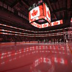 Mar 6, 2025; Dallas, Texas, USA; A view of the arena and the flag of Canada during the playing of the Canadian national anthem before the game between the Dallas Stars and the Calgary Flames at the American Airlines Center.