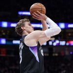 Mar 14, 2025; Salt Lake City, Utah, USA; Utah Jazz forward Lauri Markkanen (23) shoots a three point basket during the first quarter against the Toronto Raptors at Delta Center.