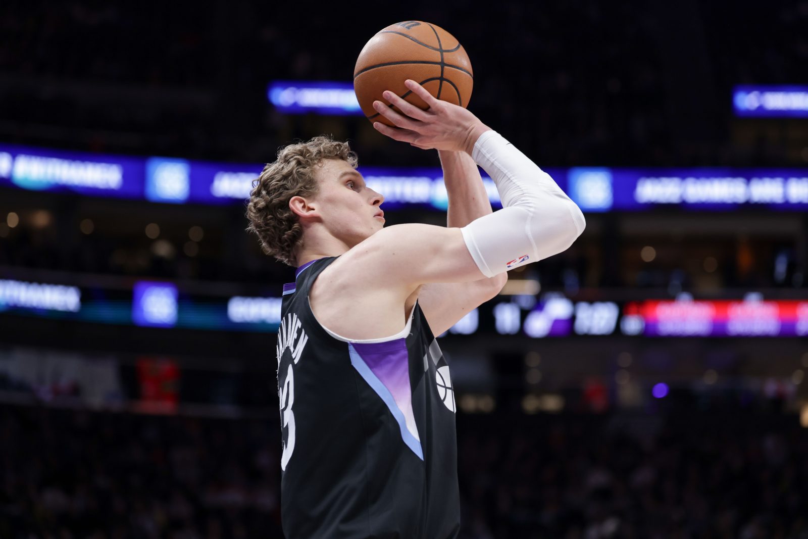 Mar 14, 2025; Salt Lake City, Utah, USA; Utah Jazz forward Lauri Markkanen (23) shoots a three point basket during the first quarter against the Toronto Raptors at Delta Center.