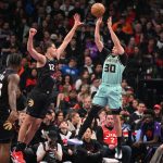 Mar 28, 2025; Toronto, Ontario, CAN; Charlotte Hornets guard Seth Curry (30) shoots the ball over Toronto Raptors forward Cole Swider (12) in the first half at Scotiabank Arena.