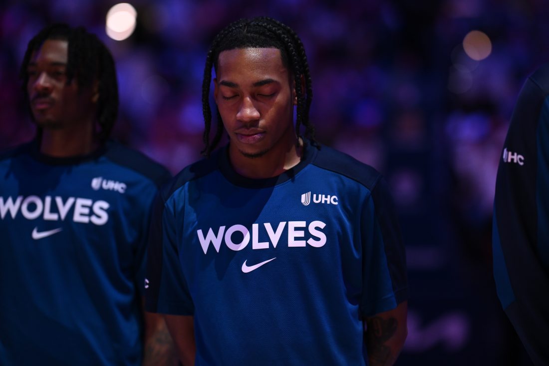 Apr 5, 2025; Philadelphia, Pennsylvania, USA; Minnesota Timberwolves guard Rob Dillingham (4) observes the national anthem before the game against the Philadelphia 76ers at Wells Fargo Center.