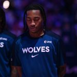 Apr 5, 2025; Philadelphia, Pennsylvania, USA; Minnesota Timberwolves guard Rob Dillingham (4) observes the national anthem before the game against the Philadelphia 76ers at Wells Fargo Center.