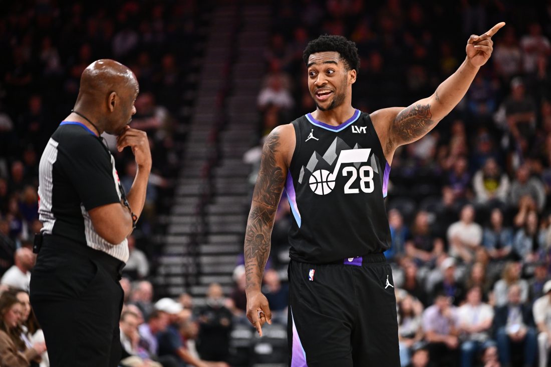 Apr 9, 2025; Salt Lake City, Utah, USA; Utah Jazz forward Brice Sensabaugh (28) talks with referee Derek Richardson (63) during the second half of a game against the Portland Trail Blazers at Delta Center. Mandatory Credit: Jamie Sabau-Imagn Images