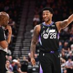 Apr 9, 2025; Salt Lake City, Utah, USA; Utah Jazz forward Brice Sensabaugh (28) talks with referee Derek Richardson (63) during the second half of a game against the Portland Trail Blazers at Delta Center. Mandatory Credit: Jamie Sabau-Imagn Images