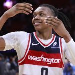 Apr 13, 2025; Miami, Florida, USA; Washington Wizards guard Bub Carrington (8) celebrates the Wizards win against the Miami Heat at Kaseya Center.