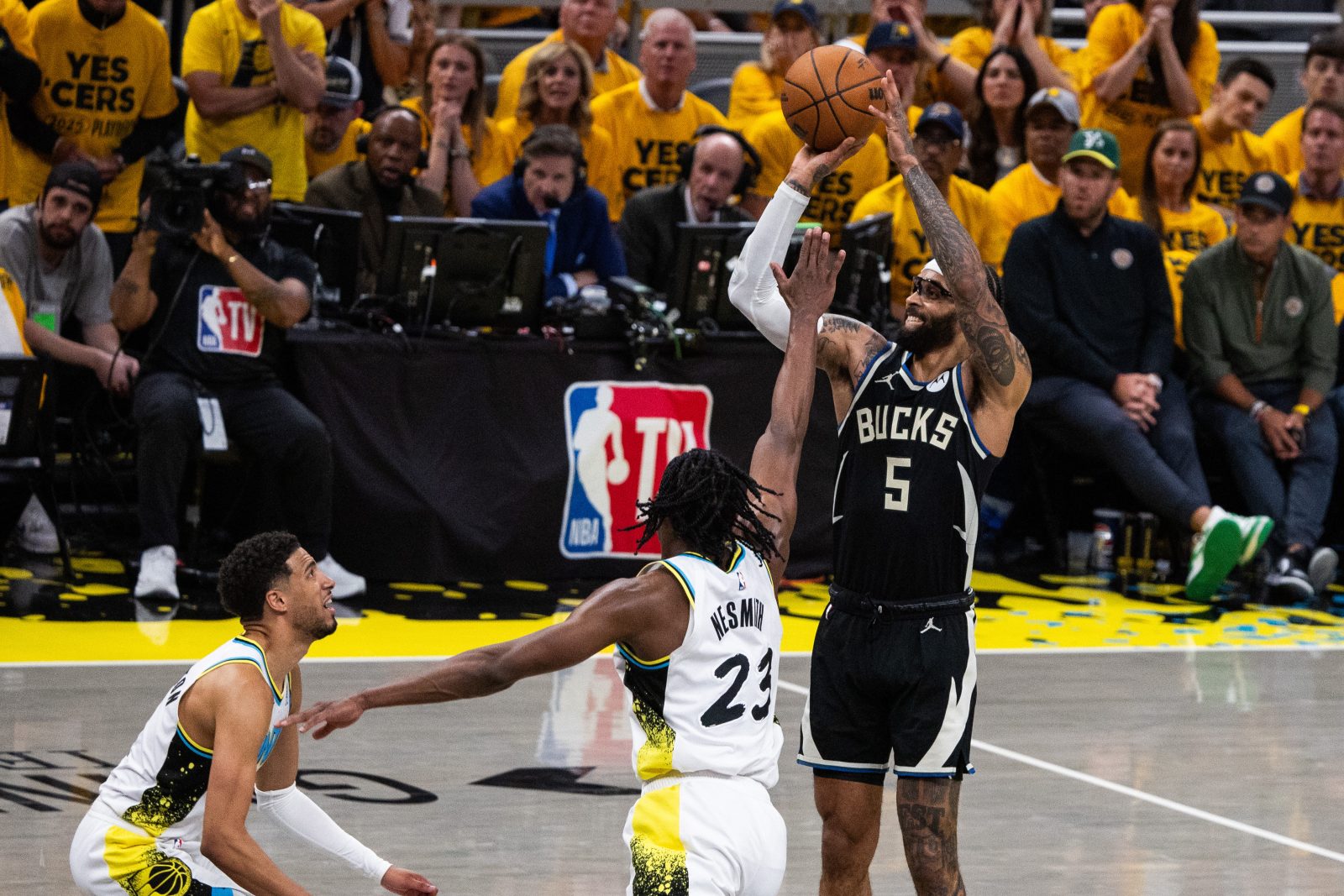 Apr 29, 2025; Indianapolis, Indiana, USA; Milwaukee Bucks guard Gary Trent Jr. (5) shoots the ball while Indiana Pacers forward Aaron Nesmith (23) defends during game five of the first round for the 2024 NBA Playoffs at Gainbridge Fieldhouse.