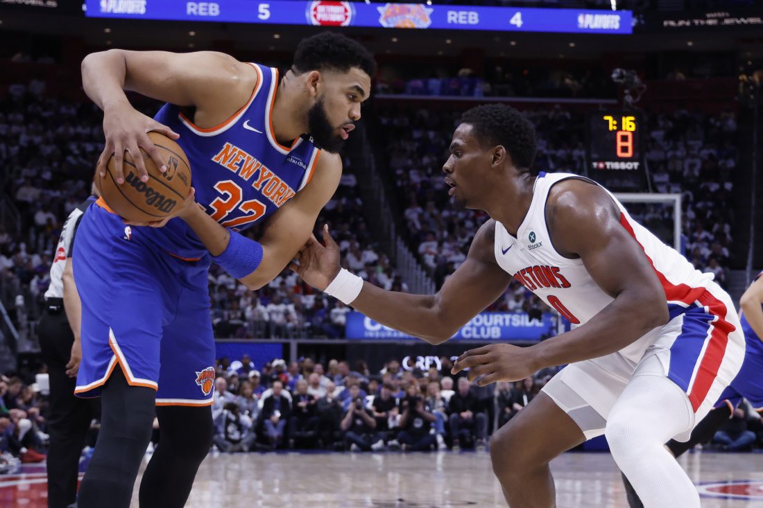 May 1, 2025; Detroit, Michigan, USA; New York Knicks center Karl-Anthony Towns (32) is defended by Detroit Pistons center Jalen Duren (0) in the first half during game six of first round for the 2024 NBA Playoffs at Little Caesars Arena.