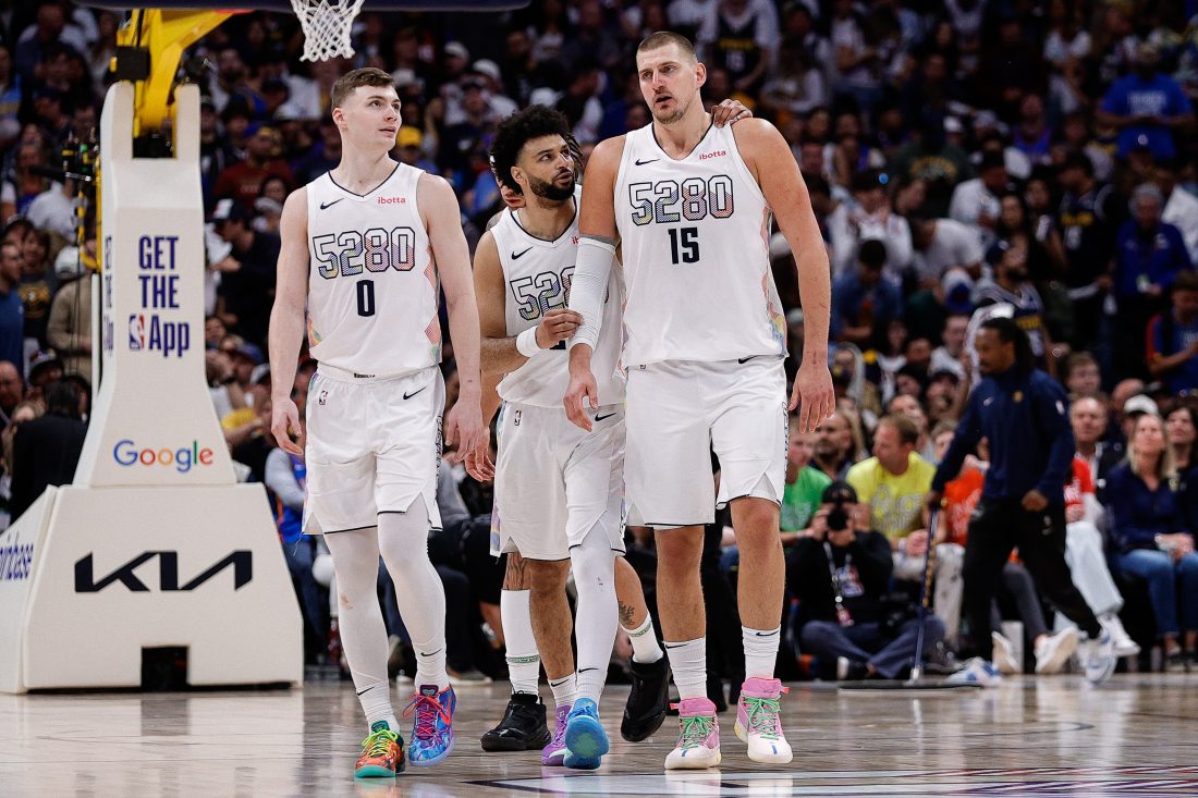 May 15, 2025; Denver, Colorado, USA; Denver Nuggets guard Jamal Murray (27) and center Nikola Jokic (15) and guard Christian Braun (0) in the fourth quarter against the Oklahoma City Thunder during game six of the second round for the 2025 NBA Playoffs at Ball Arena.
