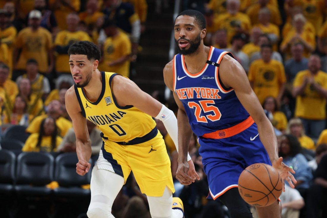 May 31, 2025; Indianapolis, Indiana, USA; New York Knicks forward Mikal Bridges (25) dribbles the ball defended by Indiana Pacers guard Tyrese Haliburton (0) in the third quarter during game six of the eastern conference finals for the 2025 NBA Playoffs at Gainbridge Fieldhouse. Mandatory Credit: Trevor Ruszkowski-Imagn Images