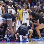 Jun 7, 2025; Chicago, Illinois, USA; Chicago Sky guard Courtney Vandersloot (22) reacts after being injured during the first half of a WNBA game against the Indiana Fever at United Center. Mandatory Credit: Kamil Krzaczynski-Imagn Images