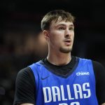 Jul 12, 2025; Las Vegas, NV, USA; Dallas Mavericks forward Cooper Flagg (32) looks on against the San Antonio Spurs in the second quarter of their game at Thomas & Mack Center.