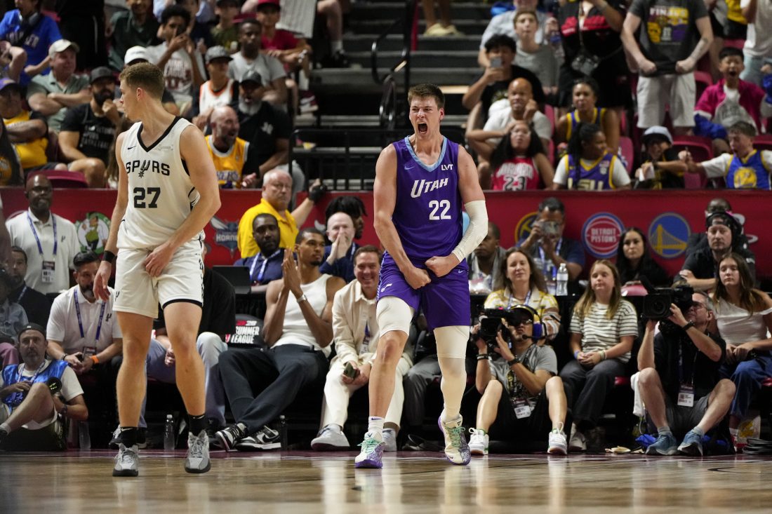 Jul 14, 2025; Las Vegas, NV, USA; Utah Jazz forward Kyle Filipowski (22) reacts after scoring against the San Antonio Spurs during overtime in a NBA basketball game at the Thomas & Mack Center. Mandatory Credit: Lucas Peltier-Imagn Images