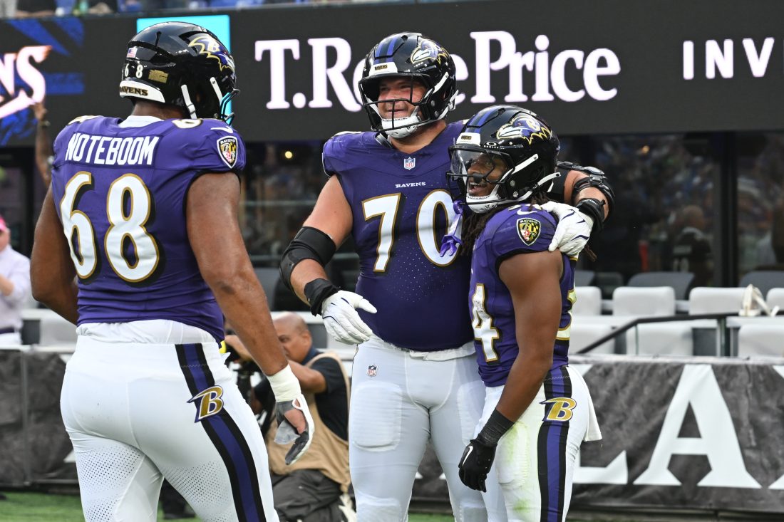 Aug 7, 2025; Baltimore, Maryland, USA; Baltimore Ravens running back Keaton Mitchell (34) celebrates scoring a touchdown with offensive tackle Roger Rosengarten (70) and offensive tackle Joseph Noteboom (68) against the Indianapolis Colts during the first quarter at M&T Bank Stadium. Mandatory Credit: Rafael Suanes-Imagn Images