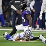 Aug 16, 2025; Arlington, Texas, USA; Baltimore Ravens linebacker Jay Higgins IV (49) sacks Dallas Cowboys quarterback Will Grier (15) during the second half at AT&T Stadium. Mandatory Credit: Jerome Miron-Imagn Images