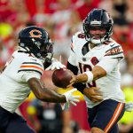 Aug 22, 2025; Kansas City, Missouri, USA; Chicago Bears quarterback Caleb Williams (18) hands off to running back D'Andre Swift (4) during the first half against the Kansas City Chiefs at GEHA Field at Arrowhead Stadium. Mandatory Credit: Jay Biggerstaff-Imagn Images