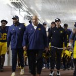 Aug 30, 2025; Ann Arbor, Michigan, USA; Michigan Wolverines head coach Sherone Moore and Athletic Director Warde Manuel lead the team up the tunnel after the game against the New Mexico Lobos at Michigan Stadium. Mandatory Credit: Rick Osentoski-Imagn Images