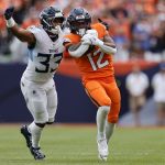 Sep 7, 2025; Denver, Colorado, USA; Denver Broncos running back RJ Harvey (12) rushes the ball against the Tennessee Titans in the second half at Empower Field at Mile High. Mandatory Credit: Isaiah J. Downing-Imagn Images
