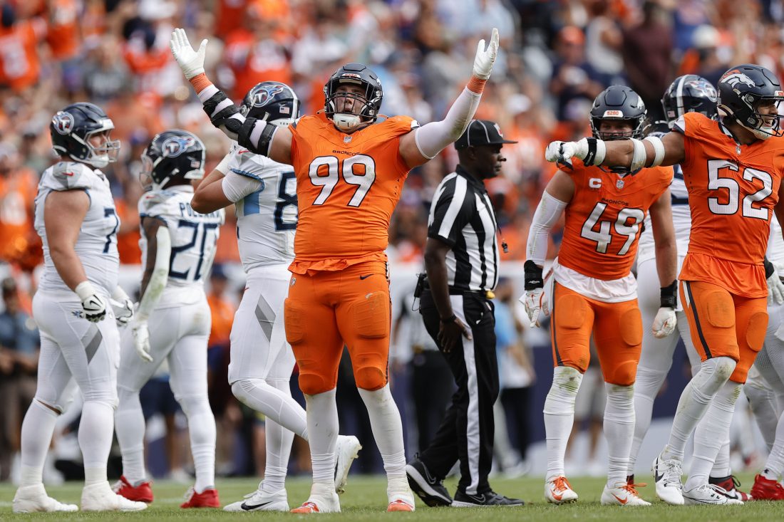 Sep 7, 2025; Denver, Colorado, USA; Denver Broncos defensive end Zach Allen (99) reacts against the Tennessee Titans in the second half at Empower Field at Mile High.