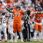Sep 7, 2025; Denver, Colorado, USA; Denver Broncos defensive end Zach Allen (99) reacts against the Tennessee Titans in the second half at Empower Field at Mile High.