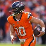 Sep 7, 2025; Denver, Colorado, USA; Denver Broncos quarterback Bo Nix (10) rushes the ball against the Tennessee Titans in the second half at Empower Field at Mile High.