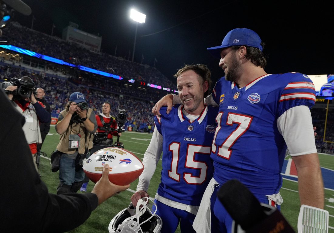 Buffalo Bills quarterback Josh Allen chats with Matt Prater who won the game with his field goal attempt. Prater received a Sunday Night football after the game at Highmark Stadium in Orchard Park on Sept. 7, 2025.
