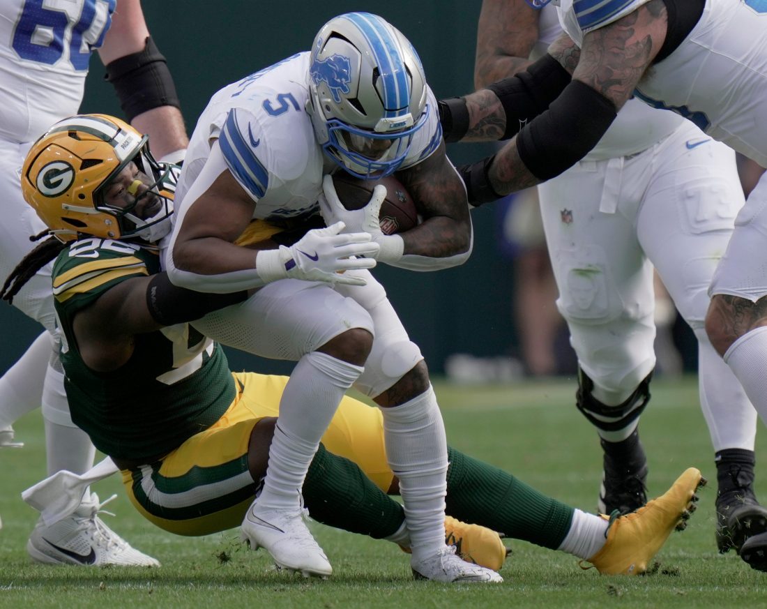 Green Bay Packers defensive end Rashan Gary (52) tackles Detroit Lions running back David Montgomery (5) during the first quarter of their game Sunday, September 7, 2025 at Lambeau Field in Green Bay, Wisconsin.