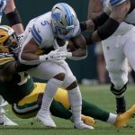 Green Bay Packers defensive end Rashan Gary (52) tackles Detroit Lions running back David Montgomery (5) during the first quarter of their game Sunday, September 7, 2025 at Lambeau Field in Green Bay, Wisconsin.