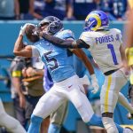 Tennessee Titans wide receiver Elic Ayomanor (5) pulls the ball down ahead of Los Angeles Rams cornerback Emmanuel Forbes Jr. (1) during the second quarter at Nissan Stadium in Nashville, Tenn., Sunday, Sept. 14, 2025.